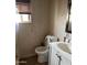 Bathroom featuring tile flooring, white fixtures, and natural light at 2912 E Monroe St, Phoenix, AZ 85034