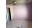 Bedroom featuring tile flooring, a ceiling fan, and a closet with sliding doors at 2912 E Monroe St, Phoenix, AZ 85034