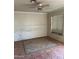 Bedroom featuring tile flooring, a ceiling fan, and a bright window at 2912 E Monroe St, Phoenix, AZ 85034