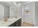 Modern bathroom with dual sinks, granite countertops, and a spacious shower at 31783 N 130Th Ave, Peoria, AZ 85383