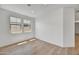 A bedroom featuring tile floors, neutral walls, and windows for natural light at 31783 N 130Th Ave, Peoria, AZ 85383