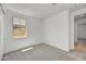 Cozy bedroom with carpet, neutral walls, and a window providing natural light at 31783 N 130Th Ave, Peoria, AZ 85383