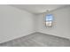 Bright bedroom with neutral walls, carpet, and a window providing natural light at 31783 N 130Th Ave, Peoria, AZ 85383