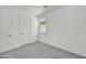 Bright bedroom with carpeted floors, a window, and a white door and trim at 31783 N 130Th Ave, Peoria, AZ 85383