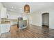 Open-concept living area showcasing wood floors, recessed lighting, and a view of the modern kitchen at 33505 N 25Th Ave, Phoenix, AZ 85085