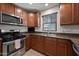 Close-up of the kitchen showcasing stainless steel appliances and sleek granite countertops at 3519 E Erie St, Gilbert, AZ 85295