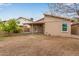 View of backyard featuring patio, home exterior, and partial landscaping at 3613 W Camino Real --, Glendale, AZ 85310