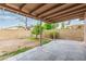 View of covered patio, concrete block wall and landscaped backyard at 3613 W Camino Real --, Glendale, AZ 85310