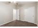 Neutral bedroom with a ceiling fan, plush carpet and a closet with white sliding doors at 3613 W Camino Real --, Glendale, AZ 85310