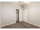Bedroom featuring neutral walls, carpet flooring, and closet with sliding doors at 3613 W Camino Real --, Glendale, AZ 85310