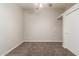 Neutral bedroom featuring carpet flooring, a ceiling fan, closet and a window at 3613 W Camino Real --, Glendale, AZ 85310