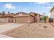 Single-story home with desert landscaping and a two-car garage, complemented by a well-maintained exterior at 3613 W Camino Real --, Glendale, AZ 85310