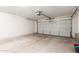 Spacious garage with roll up door and concrete flooring at 3613 W Camino Real --, Glendale, AZ 85310