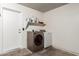 Laundry room featuring side by side washer and dryer with a shelf above at 3613 W Camino Real --, Glendale, AZ 85310