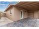 Covered patio with concrete block home and stone flooring at 3613 W Camino Real --, Glendale, AZ 85310
