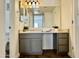 Bathroom with large mirror, cabinets, tiled floors, stylish vanity with plants for a refreshing touch at 3825 E Camelback Rd # 292, Phoenix, AZ 85018