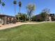Lush green lawns, mature trees, and inviting walkways define the beauty of this community at 3825 E Camelback Rd # 292, Phoenix, AZ 85018