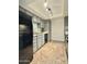 Kitchen featuring stainless steel sink, ample counter space, and a black refrigerator at 3825 E Camelback Rd # 292, Phoenix, AZ 85018