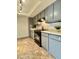 Kitchen featuring ample cabinet space, black appliances, and tile flooring at 3825 E Camelback Rd # 292, Phoenix, AZ 85018