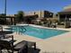 Swimming pool with lounge seating and meticulously maintained landscaping at 3825 E Camelback Rd # 292, Phoenix, AZ 85018
