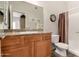 Cozy bathroom with granite countertop vanity, shower, and neutral-colored walls at 3830 E Lakewood Pkwy # 2116, Phoenix, AZ 85048