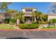 Beautiful clubhouse with decorative fountain in front and lush green landscaping at 3830 E Lakewood Pkwy # 2116, Phoenix, AZ 85048