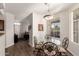 Open dining area features a glass table with seating, connecting to the living spaces at 3830 E Lakewood Pkwy # 2116, Phoenix, AZ 85048