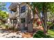 Charming condo showcases lovely landscaping, private balcony, and convenient stairway access at 3830 E Lakewood Pkwy # 2116, Phoenix, AZ 85048