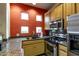 Modern kitchen with granite countertops, stainless steel appliances, and bright lighting at 3830 E Lakewood Pkwy # 2116, Phoenix, AZ 85048