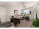Inviting living room features neutral tones, a ceiling fan, and a door to a cozy balcony at 3830 E Lakewood Pkwy # 2116, Phoenix, AZ 85048