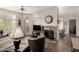 Bright living room boasts a ceiling fan, fireplace, and balcony access for relaxation at 3830 E Lakewood Pkwy # 2116, Phoenix, AZ 85048