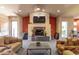 Comfortable lounge area featuring a fireplace, television, and cozy seating at 3830 E Lakewood Pkwy # 2116, Phoenix, AZ 85048