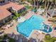 Aerial view of the sparkling pool, showing lounge areas, and lush landscaping at 3830 E Lakewood Pkwy # 2116, Phoenix, AZ 85048