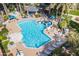 Aerial view of the inviting pool area with lounge chairs, cabana, and lush vegetation at 3830 E Lakewood Pkwy # 2116, Phoenix, AZ 85048