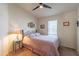 Cozy bedroom with comfortable bed, side table, and natural light from window at 40569 N Wedge Dr, San Tan Valley, AZ 85140
