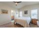 Bedroom featuring an ensuite bathroom, vaulted ceiling, and neutral colored walls at 40569 N Wedge Dr, San Tan Valley, AZ 85140