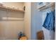Closet features built-in shelving and clothing racks for optimal storage at 40569 N Wedge Dr, San Tan Valley, AZ 85140