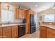 Bright kitchen featuring wooden cabinets, granite countertops, and modern appliances at 40569 N Wedge Dr, San Tan Valley, AZ 85140