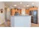Bright kitchen featuring wooden cabinets, granite countertops, and stainless steel appliances at 40569 N Wedge Dr, San Tan Valley, AZ 85140