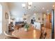 Open floor plan connecting the dining area and living room creating an inclusive space at 40569 N Wedge Dr, San Tan Valley, AZ 85140