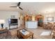 Open-concept living space features modern kitchen, dining, and living areas with stylish furnishings at 40569 N Wedge Dr, San Tan Valley, AZ 85140