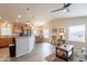 Open-concept living space with kitchen, dining, and living areas featuring vaulted ceilings, and vinyl floors at 40569 N Wedge Dr, San Tan Valley, AZ 85140