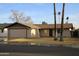 Charming single-story home with a two-car garage and xeriscaped front yard at 419 E Gemini Dr, Tempe, AZ 85283