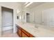A stunning bathroom features a double sink, a large mirror, and ample lighting that makes this space ideal at 42209 N 46Th Ln, Phoenix, AZ 85086