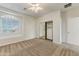 This bedroom features plush carpeting, closet with mirrored doors, and a beautiful window that offers plenty of natural light at 42209 N 46Th Ln, Phoenix, AZ 85086