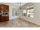 Well-lit dining area features an oven, a backyard view, and tiled floor at 42209 N 46Th Ln, Phoenix, AZ 85086