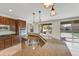 Bright kitchen featuring granite countertops, stainless appliances, and backyard access at 42209 N 46Th Ln, Phoenix, AZ 85086