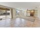 Spacious living room with fireplace and large sliding doors, offering abundant natural light at 42209 N 46Th Ln, Phoenix, AZ 85086