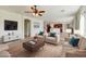 Cozy living room area with ample seating, modern furnishings, and open-concept design at 42209 N 46Th Ln, Phoenix, AZ 85086