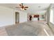 Spacious living area with an open layout, tile flooring, and access to the kitchen at 42209 N 46Th Ln, Phoenix, AZ 85086